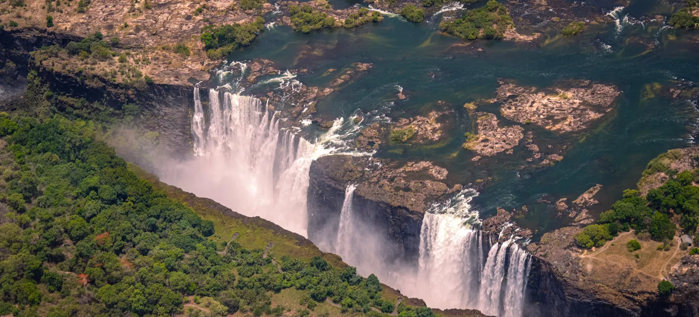 Aerial view of Victoria Falls and the Zambezi from above — the helicopter perspective