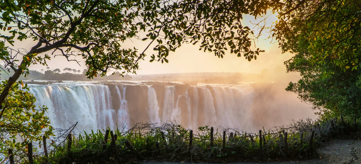Victoria Falls in warm light, seen from the Zimbabwean side